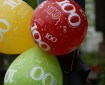 Balloner rød-grøn-gul med tallet 100